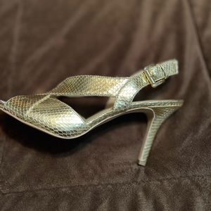 Brand new gold colored heeled sandals